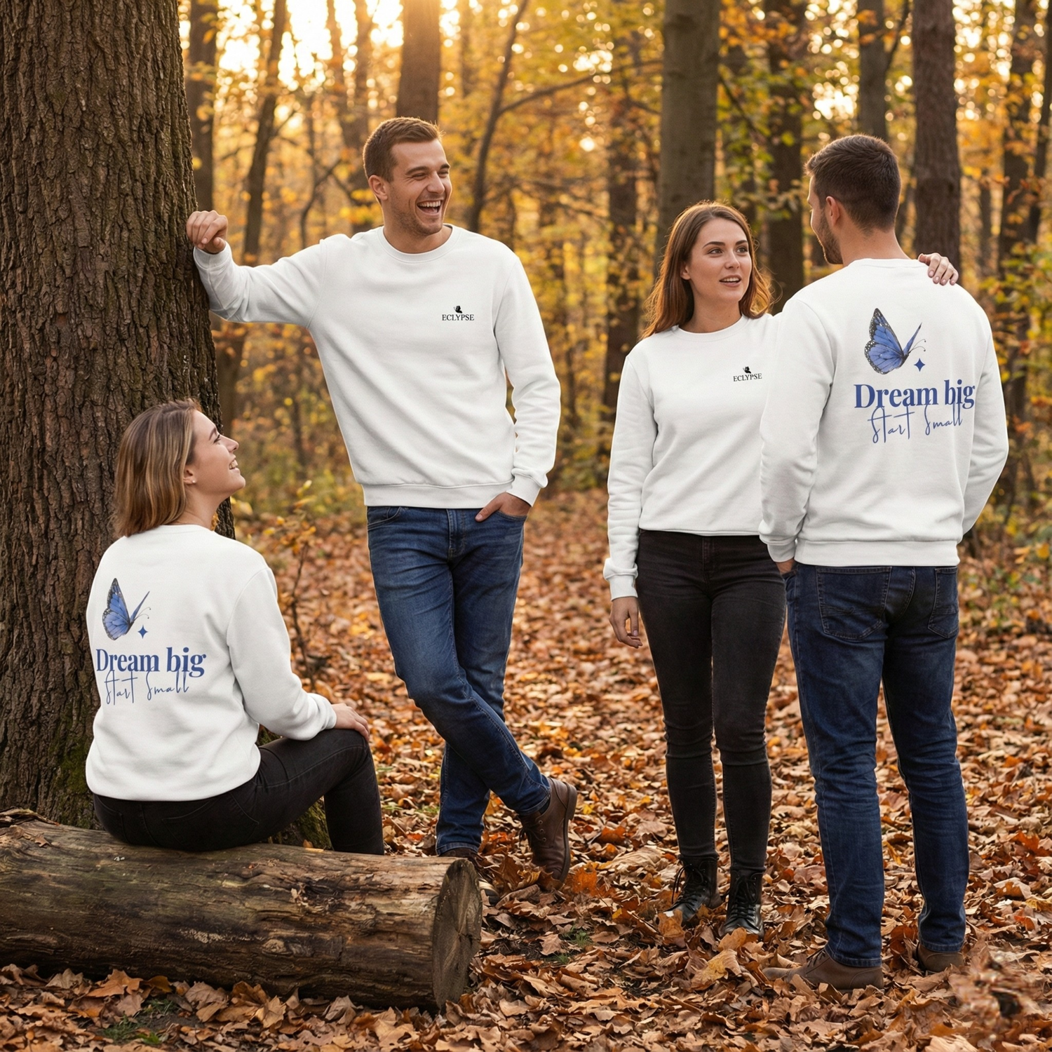 Groep van vier mensen in een herfstbos die witte Eclypse sweaters dragen met de blauwe vlinder en quote.